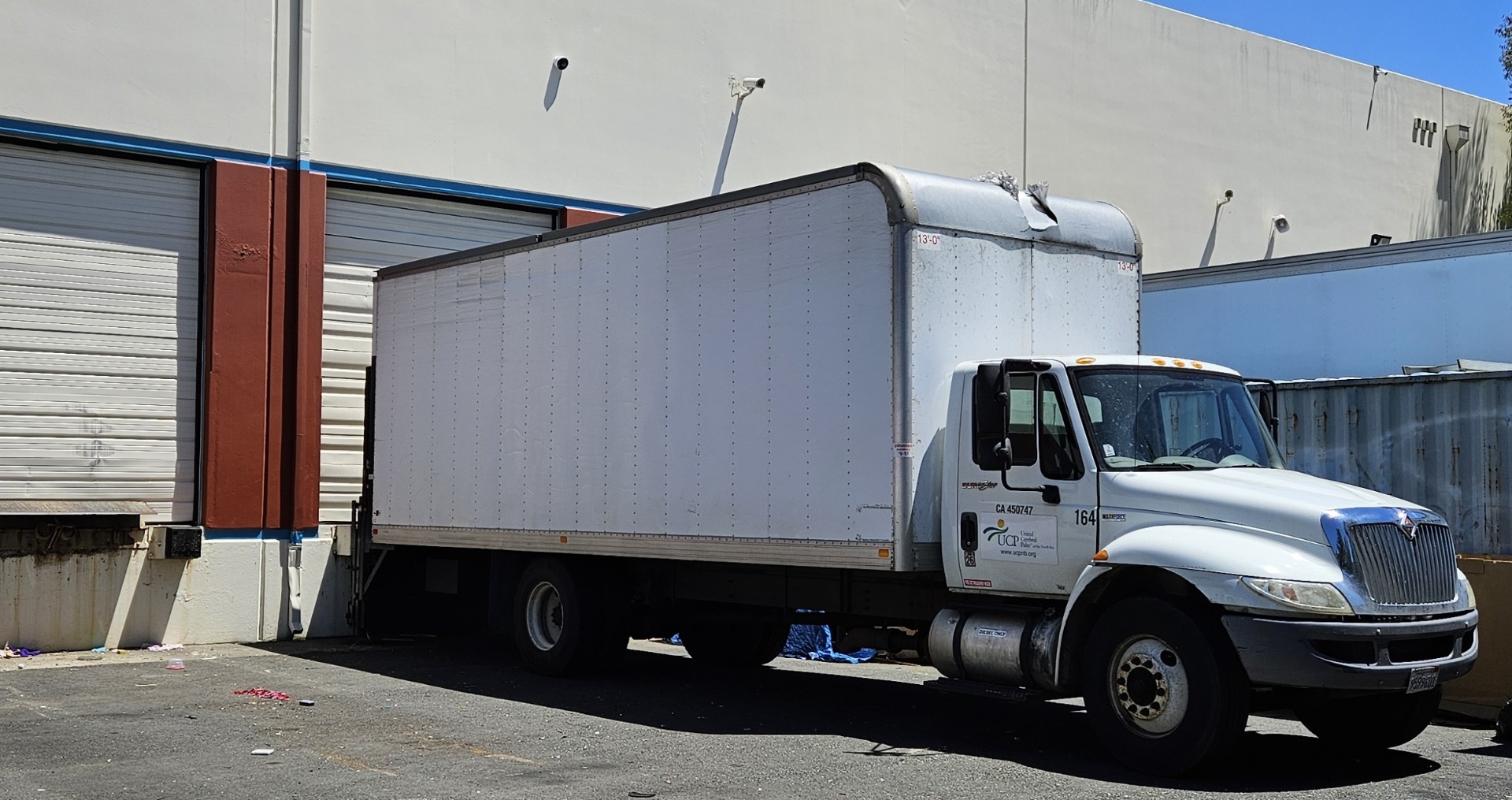 A UCP of the North Bay box truck (unit 164) backed up to the warehouse loading dock